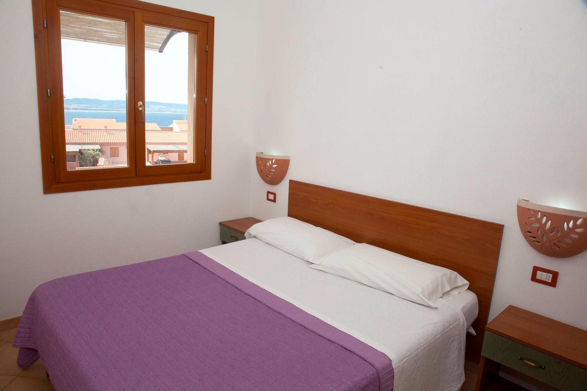 Air Borgo Della Torre Aparthotel Isola Rossa Bagian luar foto