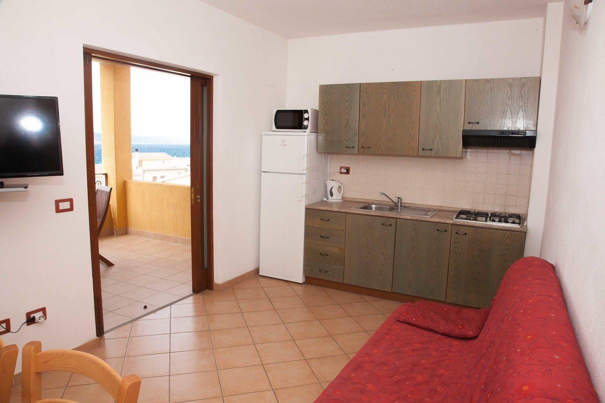 Air Borgo Della Torre Aparthotel Isola Rossa Bagian luar foto
