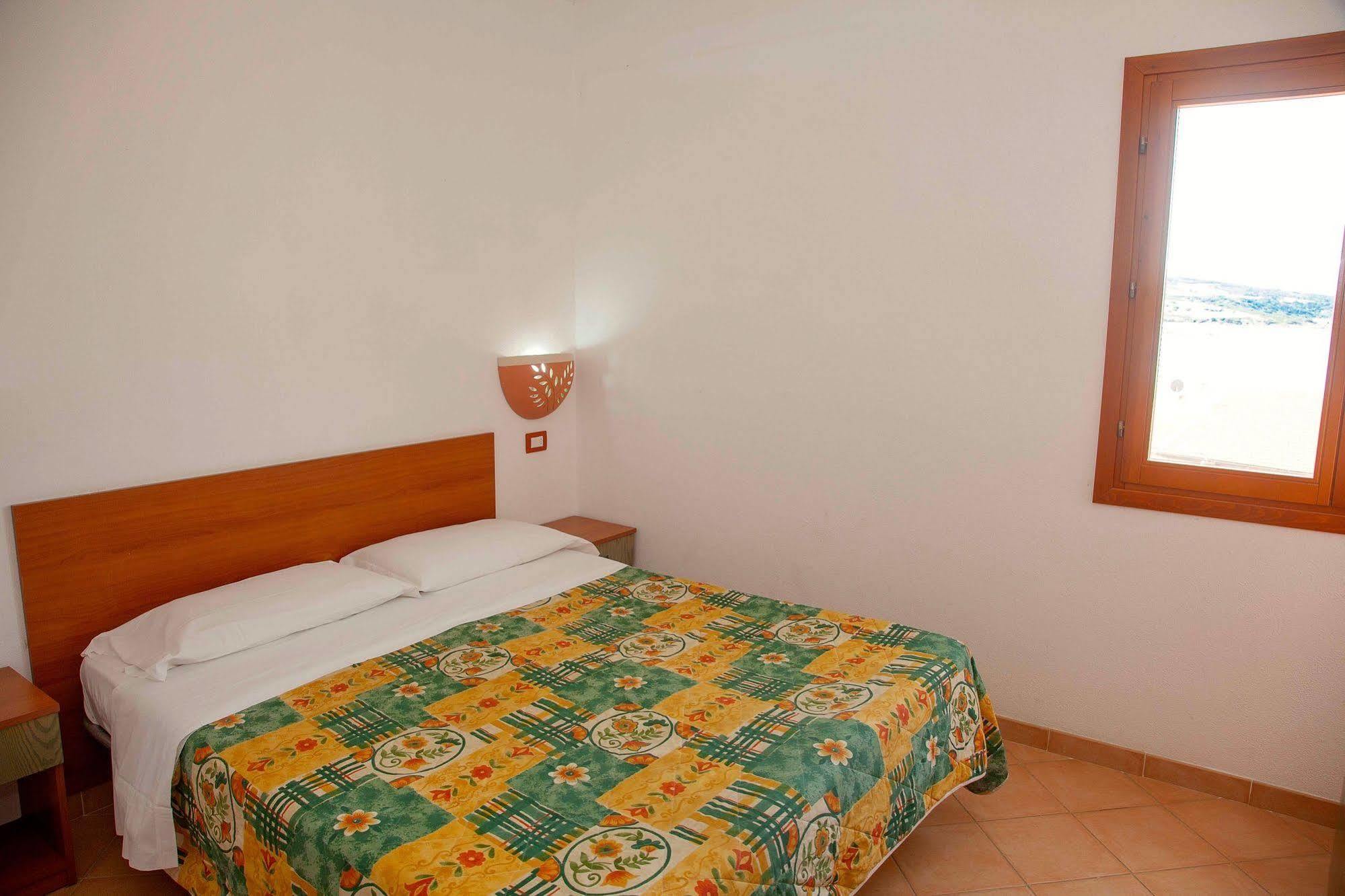 Air Borgo Della Torre Aparthotel Isola Rossa Bagian luar foto