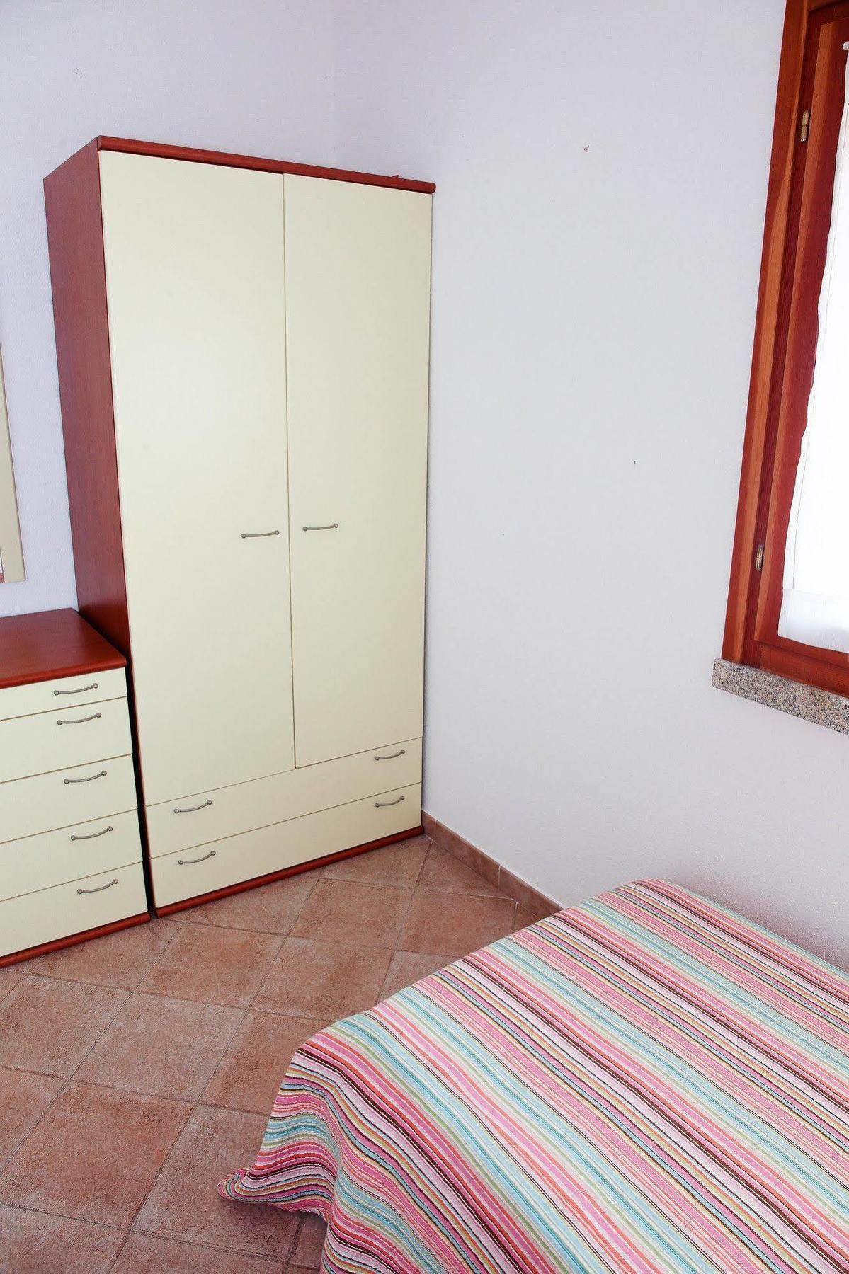 Air Borgo Della Torre Aparthotel Isola Rossa Bagian luar foto