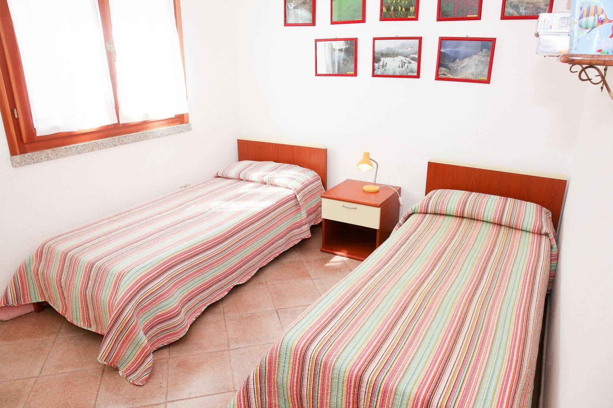 Air Borgo Della Torre Aparthotel Isola Rossa Bagian luar foto